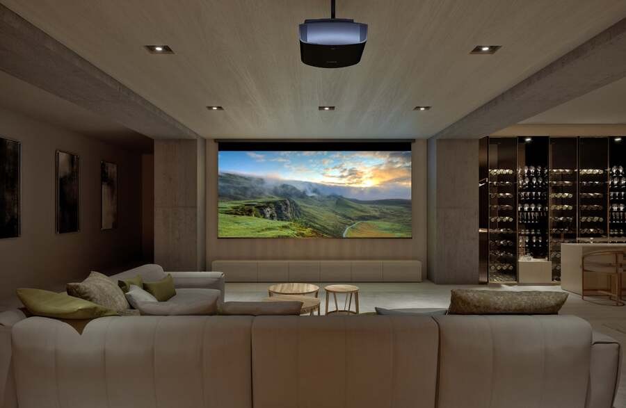 A luxury home theater where the projector displays a landscape in realistic colors and high-picture quality.